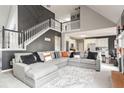Spacious living room with a large sectional sofa and fireplace at 405 Marvin Ct, Mcdonough, GA 30252