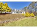 Two-story home with stone accents, large windows, and a lush lawn at 4320 Chapel Hill Farms Dr, Douglasville, GA 30135