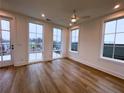 Bright bedroom with hardwood floors, large windows, and access to a deck at 919 Hughley Se Cir # 72, Atlanta, GA 30316