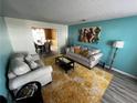 Living room with comfortable seating and a view into the dining area at 1224 Labrador Ln, Riverdale, GA 30296