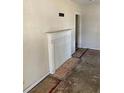 Simple living room featuring a white fireplace and hardwood floors at 2725 Blount St, East Point, GA 30344