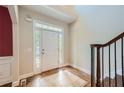 Two-story foyer with hardwood floors and a tiled entry at 3580 Bulloch Lake Rd, Loganville, GA 30052