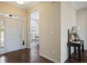 Inviting foyer with hardwood floors, a front door with sidelights, and a view into the dining room at 366 Greycoat Sw Blf, Marietta, GA 30064