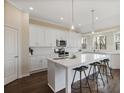 Bright eat-in kitchen featuring white cabinets, stainless steel appliances, and a large center island with bar seating at 366 Greycoat Sw Blf, Marietta, GA 30064