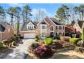 Charming two-story brick home with manicured front yard and a long driveway at 3300 Greencastle Chase Ne, Marietta, GA 30062