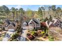 Attractive two-story brick home with manicured lawn and mature trees in a wooded area at 3300 Greencastle Chase Ne, Marietta, GA 30062