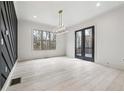 Dining room with hardwood floors, chandelier, and access to deck at 346 Langford Dr, Norcross, GA 30071