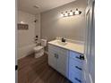 Updated bathroom with white subway tile, quartz vanity, and luxury vinyl plank flooring at 2002 Country Park Se Dr, Smyrna, GA 30080