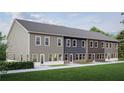 Rear view of townhouses showcasing gray, blue, and brown siding, and private backyard space at 3104 Marbella Cir # 2, Kennesaw, GA 30152