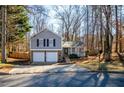 Two-story house with gray siding, two-car garage, and a yard at 3276 Rollingbrook Way, Duluth, GA 30096