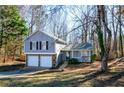 Gray siding two-story house with a two-car garage at 3276 Rollingbrook Way, Duluth, GA 30096