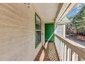 Private balcony with wood flooring and green door at 3488 Shepherds Path, Decatur, GA 30034