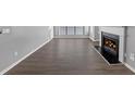 Living room with dark hardwood floors and a fireplace at 3488 Shepherds Path, Decatur, GA 30034