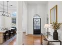 Bright entryway with hardwood floors and formal dining room view at 1263 Irwin Lake Way, Marietta, GA 30064