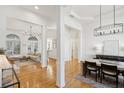 Open concept living and dining area with hardwood floors at 1263 Irwin Lake Way, Marietta, GA 30064