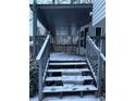 Steps leading to a covered porch with wooden railings at 4906 Holbrook Cir, Duluth, GA 30096