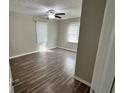 Spacious bedroom with hardwood floors and ceiling fan at 524 Jetal Nw Pl, Atlanta, GA 30318