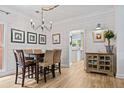Farmhouse-style dining room with shiplap walls and chandelier at 25 Highlands Way, Oxford, GA 30054