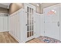 White-paneled entryway with interior door and exterior door at 25 Highlands Way, Oxford, GA 30054