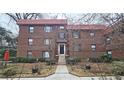 Brick building exterior with landscaping and a walkway leading to the entrance at 692 Argonne Ne Ave # 2, Atlanta, GA 30308