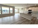 Open-concept kitchen with large island, modern appliances, and hardwood floors at 14 Cambridge Ln, Dallas, GA 30157
