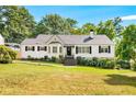 Charming white brick ranch house with a well-manicured lawn at 1417 Sheridan Ne Rd, Atlanta, GA 30324