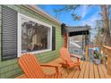 Relaxing deck with wooden chairs, offering views of the neighborhood at 1783 Pennington Se Pl, Atlanta, GA 30316