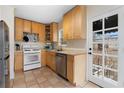 Cozy kitchen featuring wood cabinets and modern appliances at 1783 Pennington Se Pl, Atlanta, GA 30316