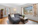 Bright living room with hardwood floors and a comfortable sectional sofa at 1783 Pennington Se Pl, Atlanta, GA 30316