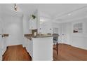 Cozy kitchen with white cabinetry, granite countertops, breakfast bar with seating at 2700 Pine Tree Ne Rd # 2306, Atlanta, GA 30324