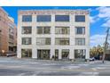 Exterior view of a multi-story building with large windows, showcasing its architecture and urban setting at 434 Marietta Nw St # 303, Atlanta, GA 30313