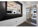 Hallway with modern design, showcasing exposed concrete columns and views into other rooms at 434 Marietta Nw St # 303, Atlanta, GA 30313