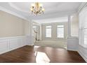 Bright dining room with hardwood floors and crown molding at 3164 Sw Wolf Club Sw Dr, Atlanta, GA 30349