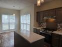 Stylish kitchen with an island, stainless steel appliances, and modern backsplash at 4019 Kingsbrook Blvd, Decatur, GA 30034