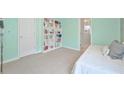 Light teal bedroom with built-in shelves and a daybed at 125 Hidden Creek Dr, Canton, GA 30114