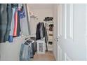 Walk-in closet with ample hanging space and shelving at 125 Hidden Creek Dr, Canton, GA 30114