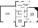 Layout of the home featuring kitchen, dining, living, garage, foyer, and breakfast nook areas at 7645 Broadhurst Dr, Riverdale, GA 30296