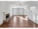 Spacious living room with hardwood floors and large windows at 3338 Carolina Wren Sw Trl, Marietta, GA 30060