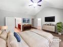 Virtually staged main bedroom with a large bed and walk-in closet at 3338 Carolina Wren Sw Trl, Marietta, GA 30060