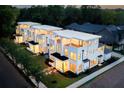 Luxury townhouses at dusk with city skyline in background at 98 Whitefoord Ne Ave # A, Atlanta, GA 30307