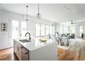 Open concept kitchen with island and living area views at 98 Whitefoord Ne Ave # A, Atlanta, GA 30307