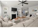 Comfortable living room featuring a fireplace, large sectional sofa, and lots of natural light at 981 Rittenhouse Way, Atlanta, GA 30316