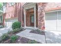 Inviting front entrance with brick facade and covered porch at 822 Northam Ln, Atlanta, GA 30342