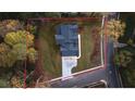 Top-down view of a house and property, showing its footprint and landscaping at 1731 N Springs Dr, Dunwoody, GA 30338