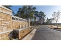 Rosewood Farms community entrance with a stone monument and fountain at 2639 Cacao Sq, Acworth, GA 30101