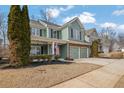 Curb appeal of a two-story house with a landscaped yard and a three-car garage at 555 Winder Trl, Canton, GA 30114