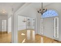 Bright entryway with hardwood floors and chandeliers at 200 Holly Chase Ct, Canton, GA 30114