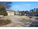 House with driveway and landscaping, neighborhood view at 200 Holly Chase Ct, Canton, GA 30114