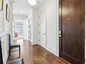 Hardwood floors and white walls in hallway at 230 Vickery Falls Dr, Roswell, GA 30075