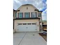 Charming two-story home featuring a two-car garage and attractive window shutters at 3990 Cavalier Way, Duluth, GA 30097